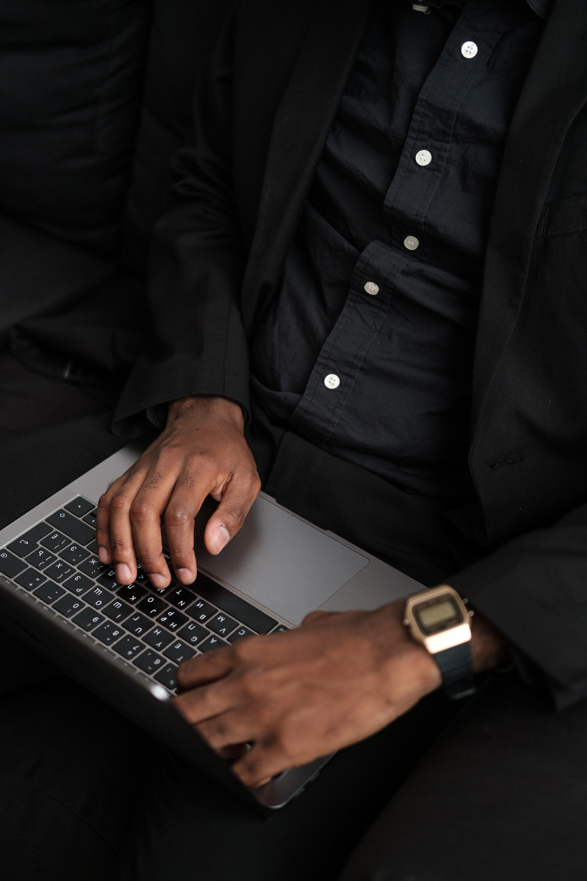 Man Typing on Laptop